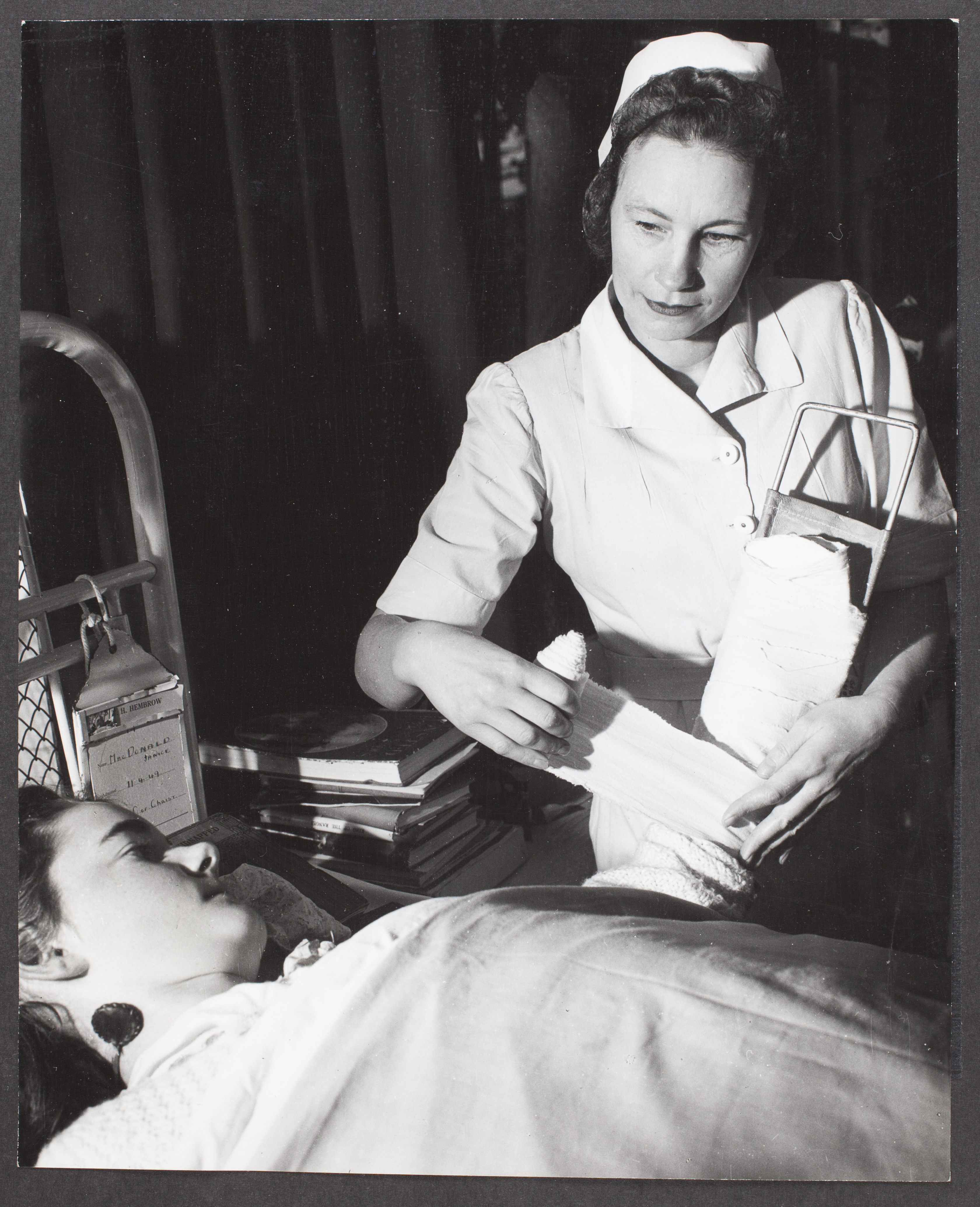 John Loughlin, “Anna Sipols, former Latvian nurse, now treats patients as a member on the nursing staff of the Austin Hospital, Melbourne”, 26 September 1949, Commercial Travellers’ Association Administrative Records and Publications, 1979.0162.03136.