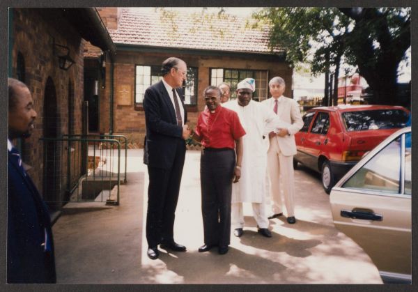 Malcolm Fraser and members of the Commonwealth Group of Eminent Persons meet with Desmond Tutu, 1986. Photographer unknown. University of Melbourne Archives, Malcolm Fraser collection, 2005.0034.00155