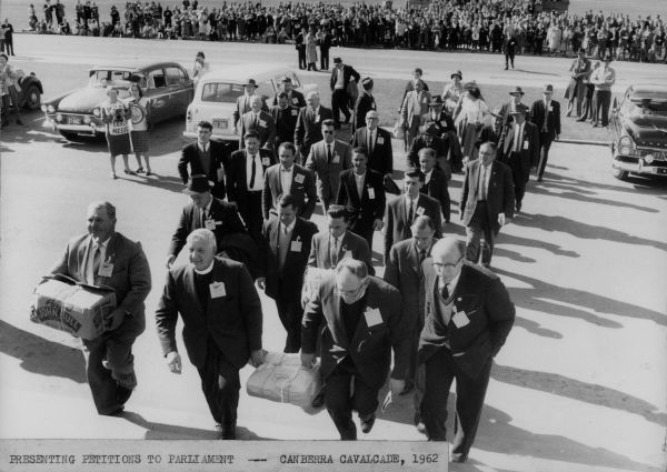 1991.0152.00113 ‘A group of men at Parliament House, Canberra presenting Peace Petitions to Parliament, during the “Canberra Cavalcade” in 1962 by John Brant Ellis. 