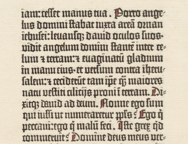 Gutenberg Bible Leaf Leaf of very old early printed book with black writing and red accents on aged paper