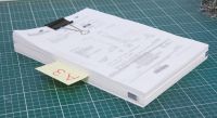 Flagging irregular items with a tag in stack of paper