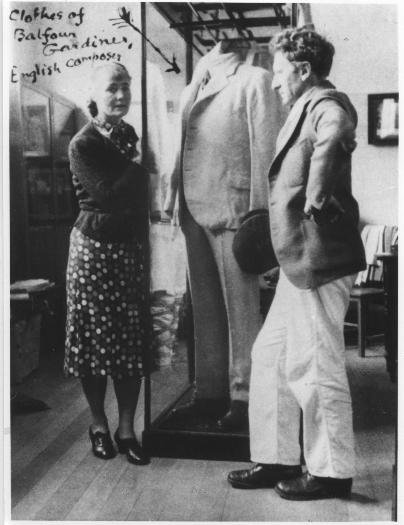 Percy and Ella Grainger with a display of the clothes of English composer Balfour Gardiner, 1938