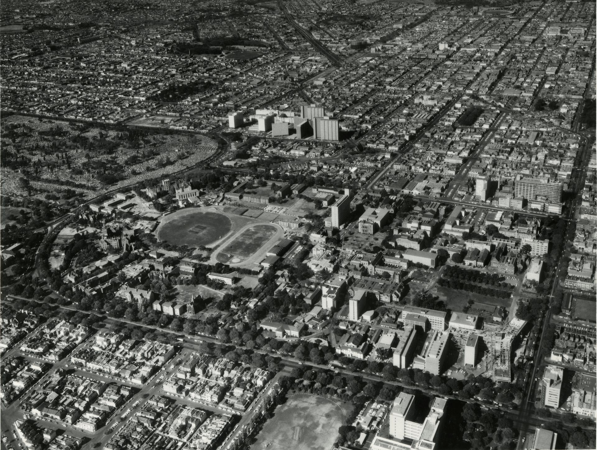 Aerial view showing the Medical precinct building in stages of completion, 1960s